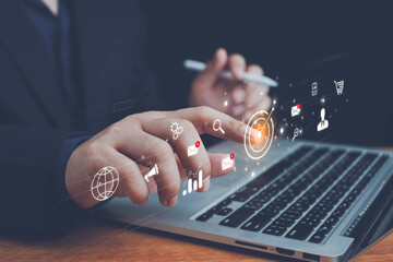 Digital marketing, close up on man hand using tab pad on laptop to working about futuristic of social media marketing icon for internet network technology and business concep. online marketing.
