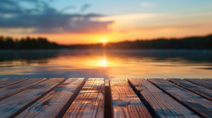 Blurry image of lake and sunset with wooden pier or table