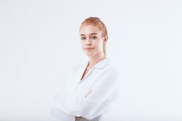 Confident female doctor or scientist posing with arms crossed on