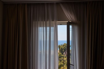 Apartment with sea view, open balcony door