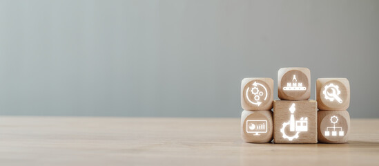 Digital icons on wooden blocks illustrating the Manufacturing Execution System concept,...