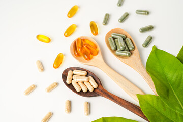 Vitamin capsules in a wooden spoon, soft gels, Fish oil capsules, omega 3, omega 9, vitamin D,...