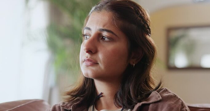 Depression, thinking and sad girl in house with mistake anxiety, regret or mental health disaster at home. Nervous, fail or woman with broken heart in living room with fear, trauma or conflict guilt