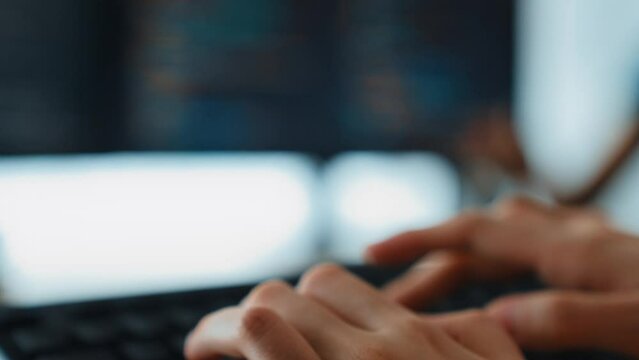 Slow motion closeup hand, back end software developer engineer for computer programming working together on debugging writing computing code, solving complex algorithms display on monitor. Burgeoning