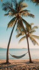 A palm tree with a hammock hanging between its two trunks