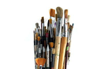 Paintbrushes varying sizes and bristle styles with wooden handles