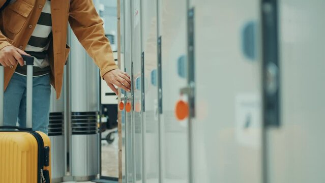 A man using coin locker for luggage storage, coin locker in Japan at train station, airport and subway, travel and transportation