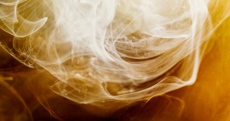 Naklejka premium Ink drop water. Smoke cloud. Blur yellow brown white color glowing haze particles texture paint swirl floating abstract art background.