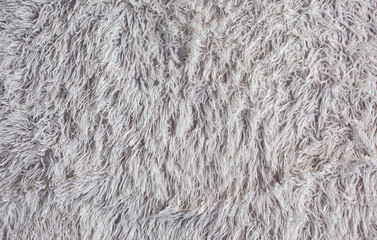 Close-up of white fake fur fabric surface