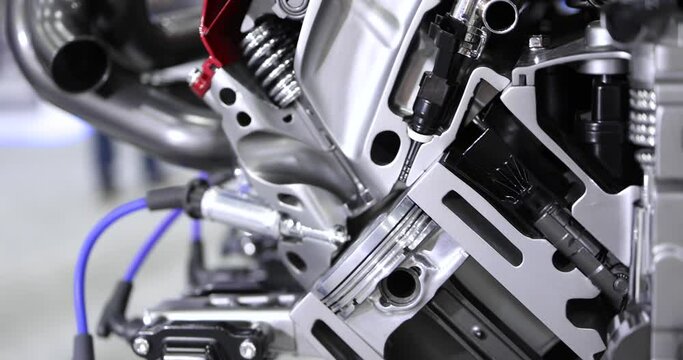 Close up view of shiny new automotive engine cut section.