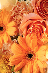 beautiful flower bouquet in orange colors, close up floral background
