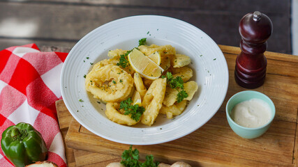 calamari served in white plate