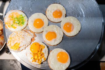 Top view of many eggs of starch fried for breakfast in the kitchen waiting to be served to guests in a luxury hotel. Prepared by professional chefs, the taste is delicious and appetizing.