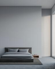 Minimalist master bedroom in light grey tones with minimal furniture, a bed next to a window and ample copy space. Bedroom interiors composition in neutral color.
