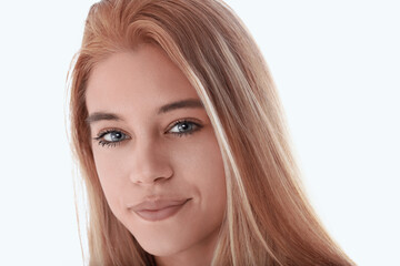 Beautiful young woman with blue eyes smiling subtly on white bac