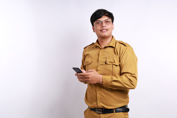 Happy Indonesian government employees standing while holding a cell phone. Isolated on white