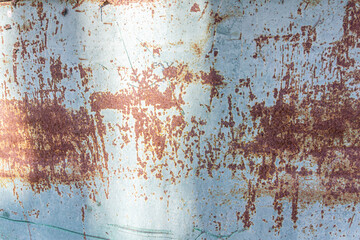 Metal sheet painted with gray color with rust. Empty deformed metal wall texture background. Distorted grunge gray metal sheet with rust. Empty gray background for minimal style designs.