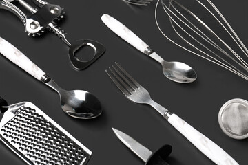 Set of kitchen utensils on black background