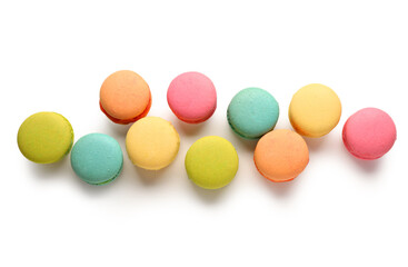 Different tasty sweet macaroons on white background