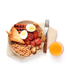 Plate with tasty English breakfast and glass of juice on white background