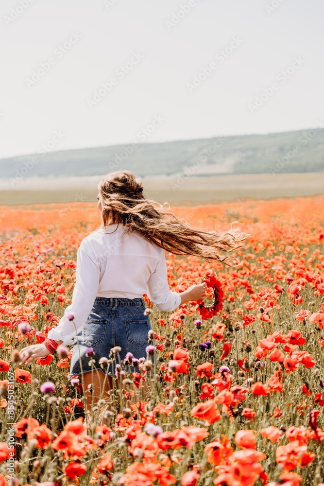 Canvas Prints happy woman in a poppy field in a white shirt and denim skirt with a wreath of poppies on her head p