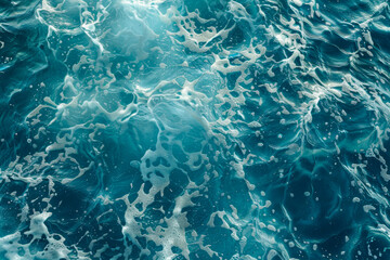 Obraz premium A close-up of ocean water with foam and ripples, showcasing the beauty and movement of the sea. The vibrant blue tones evoke a sense of calm and freshness.
