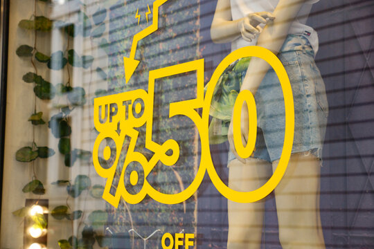 Large Sale text letters on clothing store .