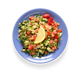 Plate with delicious tabbouleh salad and lemon slice on white background