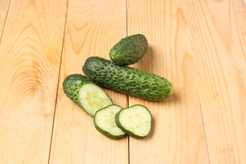 Fresh cucumbers on wooden background