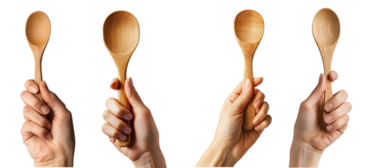 hand holding wood spoon isolated on a transparent background