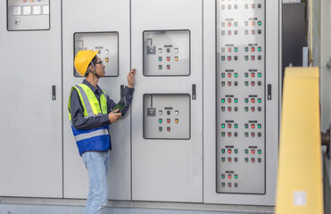 HVAC Technician Checking and Inspecting Control Panel