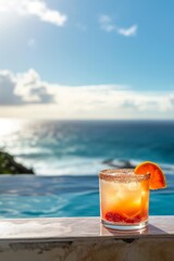Obraz premium Enjoy a refreshing cocktail by the calm waterfront pool at a tropical seascape resort.