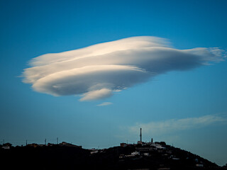 Lenticular Cloud Over Hilltop Town