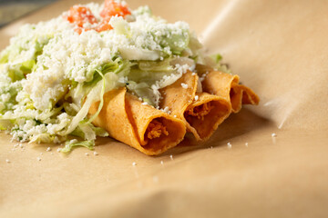 A view of three taquitos.