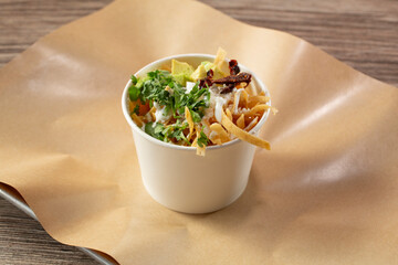 A view of a cup of chicken tortilla soup.