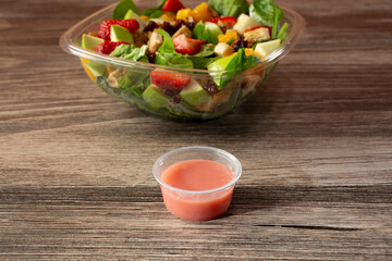 A view of a strawberry dressing for a tropical salad.