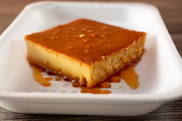A closeup view of a slice of flan.