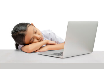 Portrait of an Asian elementary school student girl with a laptop tired of learning on the table