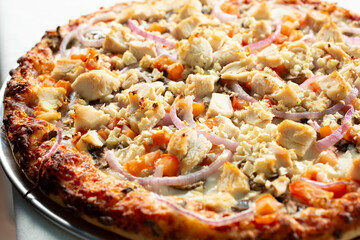 A view of a BBQ chicken pizza, without the sauce.