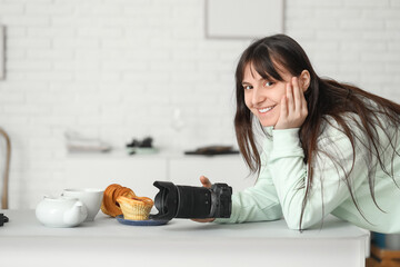 Female food photographer with camera shooting cakes in studio
