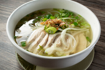 A view of a bowl of chicken pho.