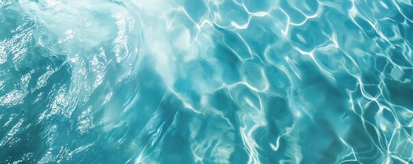 Obraz premium Clear Blue Water Surface with Sunlight Reflections. Turquoise Ocean Waves with Rippled Texture