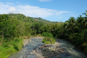 the calm flow of river water in a village 