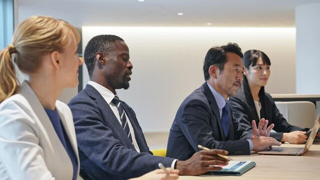 Group of multinational business people meeting in a conference room