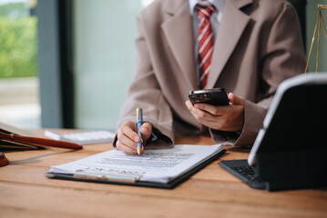 justice and law concept.law the desk, books, balance. male judge in a courtroom the gavel,working with digital tablet, smartphone