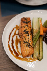 Perfectly grilled salmon steak with roasted vegetables.