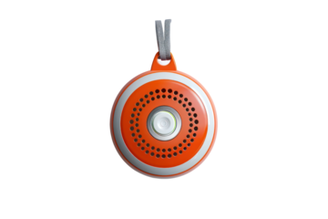 Compact round orange portable speaker with a hanging loop, perfect for outdoor use and travel. High-quality audio device with a modern design.