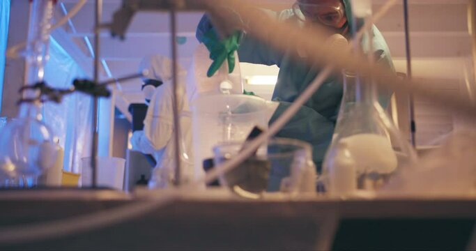 Chemical, laboratory and PPE suit for science in engineering in research, biology and medical for pharmaceuticals. Scientist, experiment and evidence for pathology, test in investigation or forensic