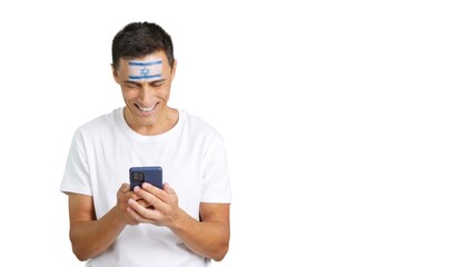 Israeli supporter looking at his mobile smiling and showing it.