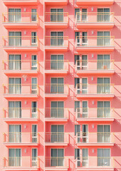 Fototapeta premium The historic building's facade features intricate brickwork and large windows